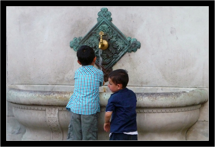 Kids playing in a fountain